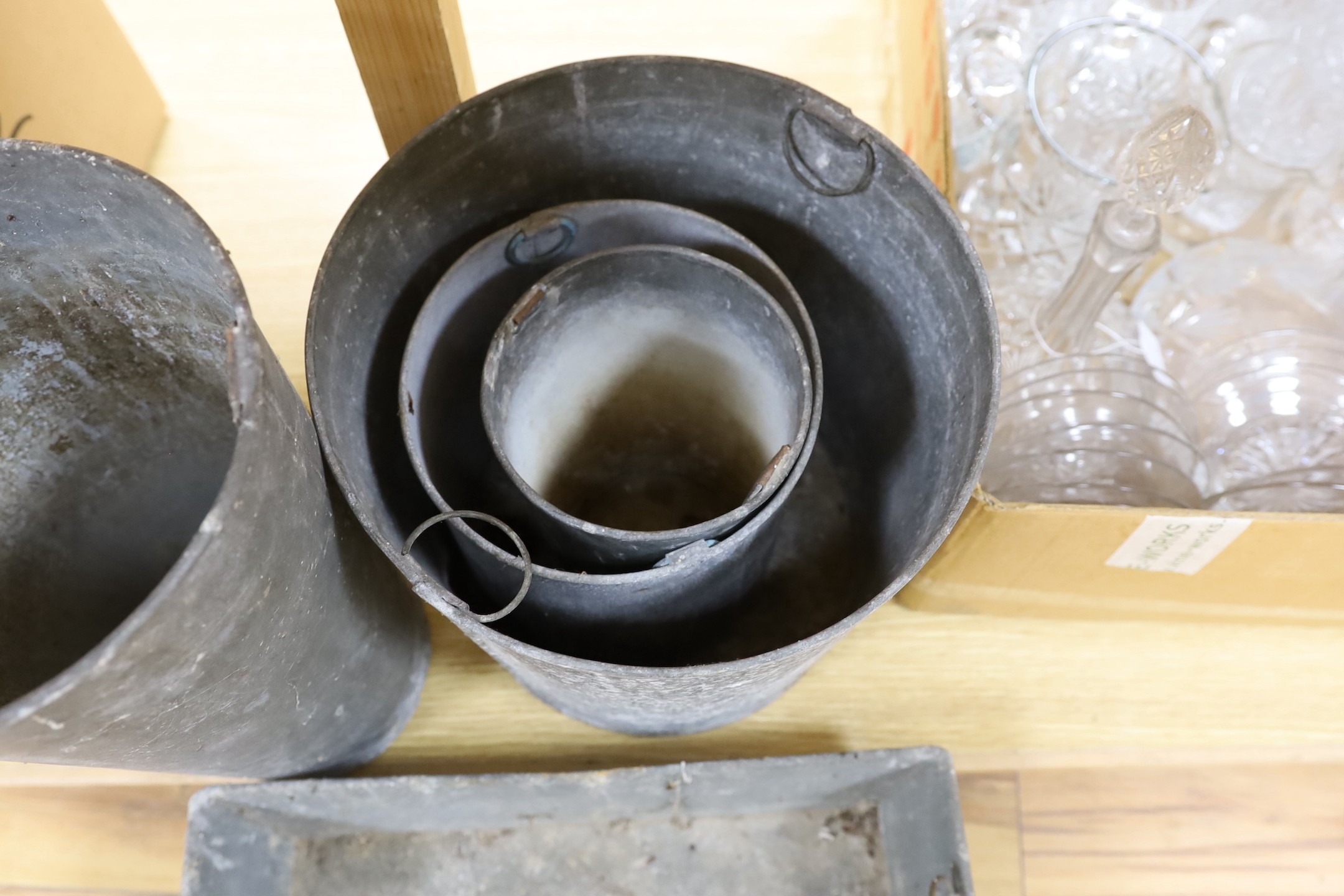 A mixed collection of galvanised troughs and wares